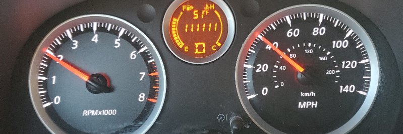 A car dashboard showing mileage 111,111