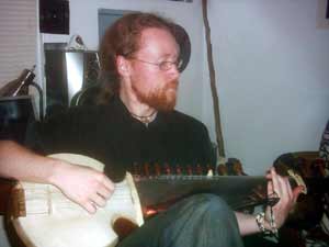 Dan Kessler playing a guitar